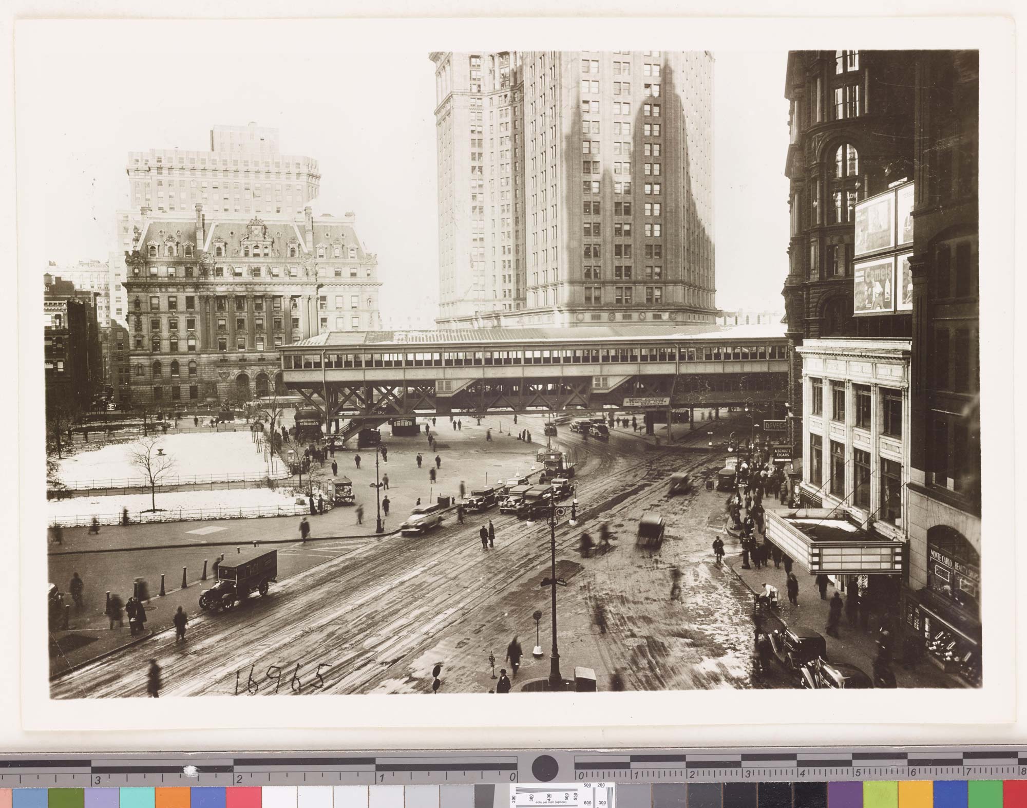 Black and white photograph showing surrogate court and Municipal Court buildings in the background and overhead passageway connection to Brooklyn Bridge.
