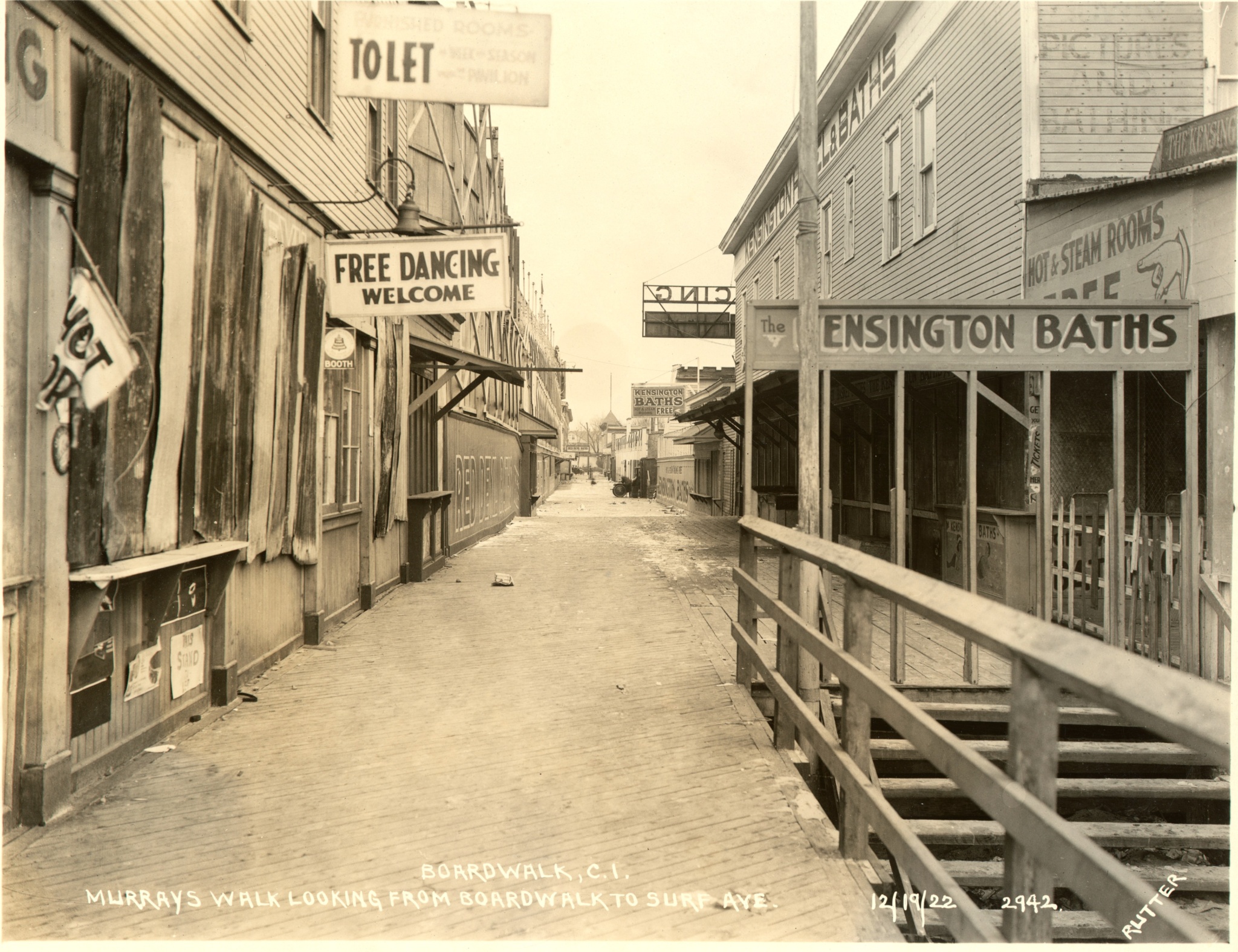 Photograph showing walk from boardwalk showing kensington baths and a dance club.