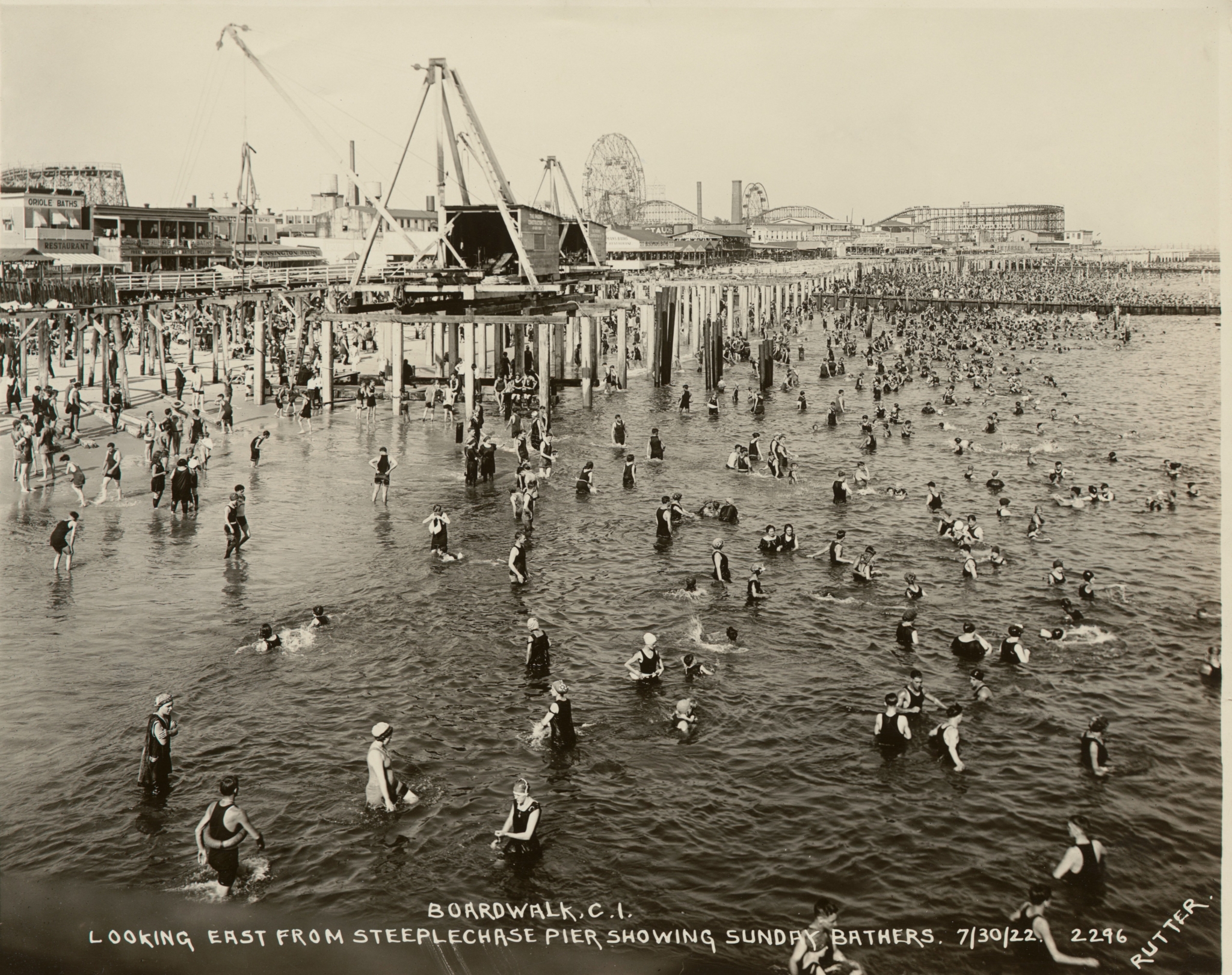 Photograph from steeplechase pier, boardwalk under construction with crowded beach
